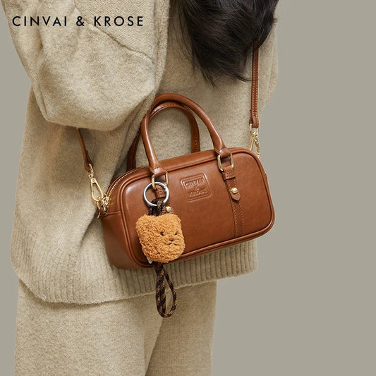 Crossbody bag with a carrying pillow pouch